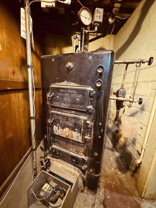 Performed comprehensive maintenance on a 98-year-old Monitor Gauge Boiler cast iron heating system. Inspection included verification of pressure gauge operation, assessment of all piping connections and fittings, examination of control components and safety devices, and evaluation of system insulation condition. All accessible components were checked for proper operation, with particular attention paid to the age and condition of this vintage Lord James Plant boiler unit to ensure continued safe operation.