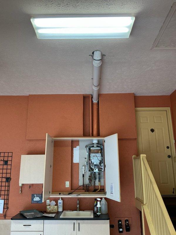 Responded to emergency gas leak at Rinnai tankless water heater in garage where gas company had shut off service at the meter. Accessed and inspected the unit, identifying a leaking gas fitting connection. Tightened the faulty fitting, performed pressure test to verify repair integrity, and confirmed no additional leaks were present. Restored gas service and tested water heater operation to ensure proper function and safety.