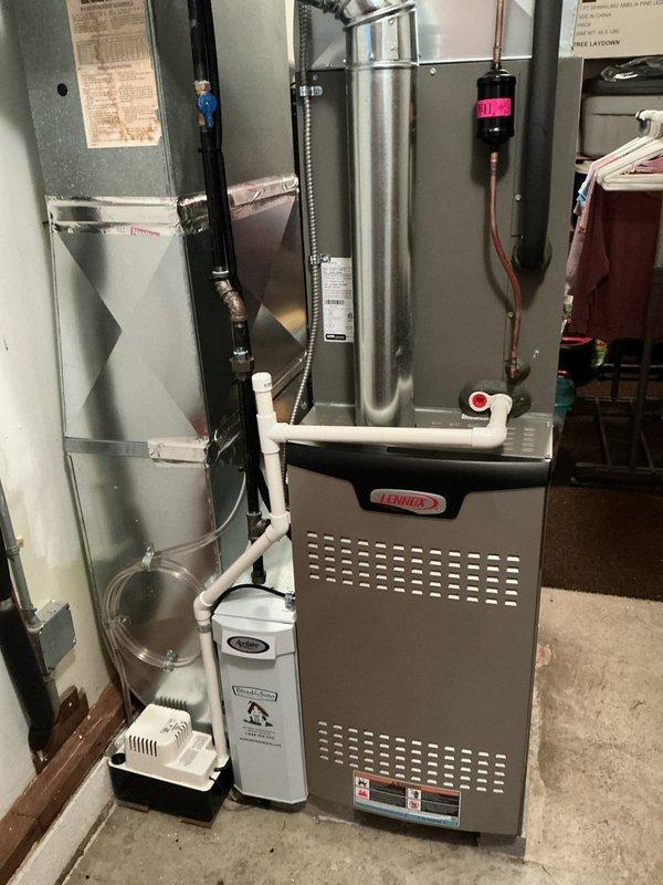 Completed scheduled MVP heating maintenance visit on Lennox furnace system. Performed comprehensive system inspection including control board examination, electrical connections verification, and safety control testing. All components operating within normal parameters. Documented system status with interior control panel and full equipment installation photos showing proper operation and maintained condition of heating equipment.