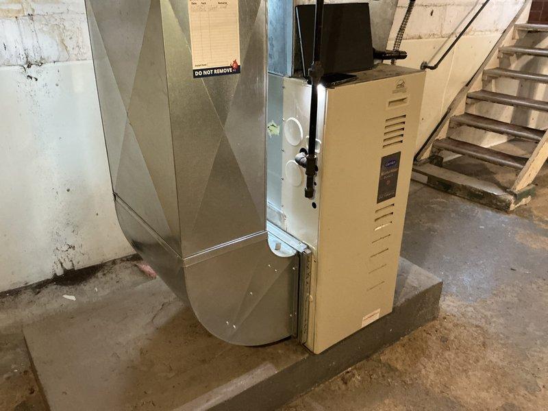 Conducted comprehensive estimate for complete furnace and air conditioning system replacement at residential property. Evaluated existing basement HVAC installation including current furnace unit, sheet metal ductwork with plenum assembly, and associated components. Assessed condition of galvanized ductwork with X-pattern reinforcement, concrete block foundation walls, and mechanical room layout. Documented equipment specifications, spatial requirements, and existing infrastructure to develop replacement proposal. Coordinated scheduling with plumbing contractor for concurrent tankless water heater, water softener, carbon filtration system installation, and water quality testing. Captured detailed photographic documentation of current furnace cabinet, supply plenum, ductwork connections, gas line configuration, electrical conduit routing, and basement mechanical space conditions to support accurate equipment sizing and installation planning.