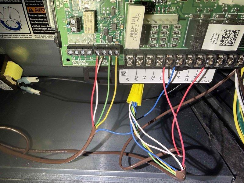 Completed scheduled MVP heating maintenance visit. Performed comprehensive system inspection including examination of electronic control board (STAR-10X PCB), terminal block wiring connections, and HVAC control components. Verified proper operation of control relays, safety switches, and valve mechanisms marked with warning labels. All electrical connections at terminal strip (V1, V2, G, Y2, Y1, R, DH) found secure with proper wire terminations. System components including Resideo control module and associated wiring inspected and confirmed in good working condition.