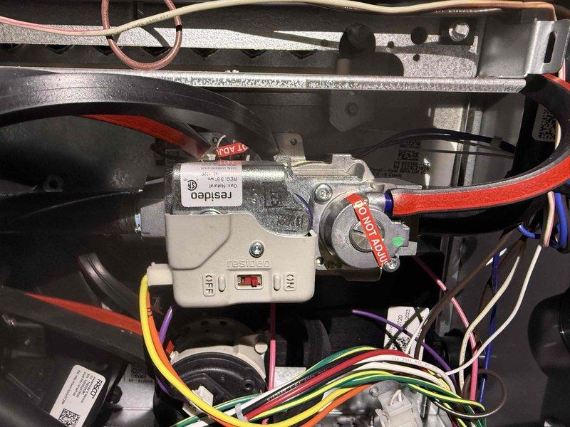 Completed scheduled MVP heating maintenance visit. Performed comprehensive system inspection including examination of electronic control board (STAR-10X PCB), terminal block wiring connections, and HVAC control components. Verified proper operation of control relays, safety switches, and valve mechanisms marked with warning labels. All electrical connections at terminal strip (V1, V2, G, Y2, Y1, R, DH) found secure with proper wire terminations. System components including Resideo control module and associated wiring inspected and confirmed in good working condition.