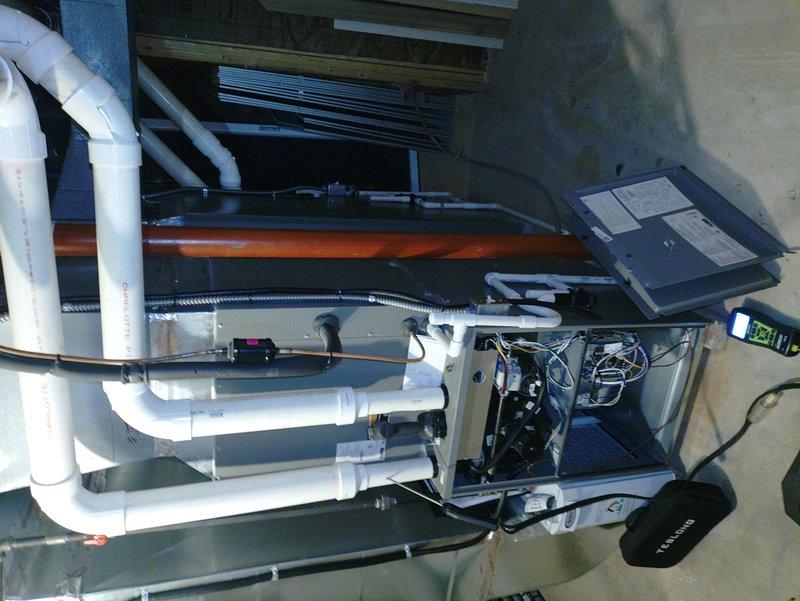 Completed annual heating maintenance on one-year-old furnace system installed in attic space. Performed comprehensive tune-up including inspection of air handling unit, verified proper operation of all internal components, control boards, and electrical connections. Inspected condensate drainage system with PVC lines, checked all ductwork connections, and confirmed system is operating within manufacturer specifications for optimal heating performance.