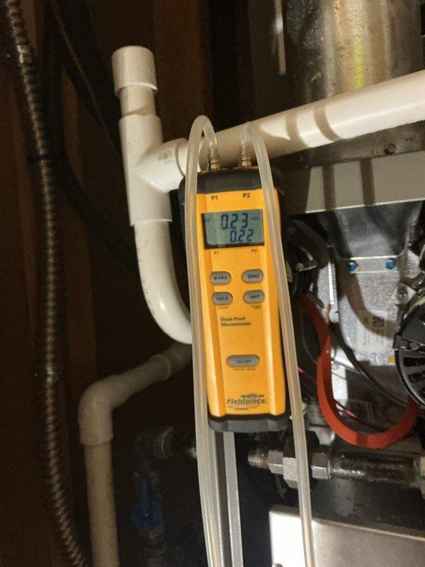 Attempted scheduled MVP heating maintenance visit but unable to gain access as customer did not answer door or phone. Performed exterior system diagnostics and documentation using manometer to verify static pressure readings of 0.23 inches water column and clamp meter to check electrical parameters, with amp draw reading 0.00 indicating system was not in operation at time of visit. Follow-up contact needed to reschedule complete heating system maintenance and inspection.