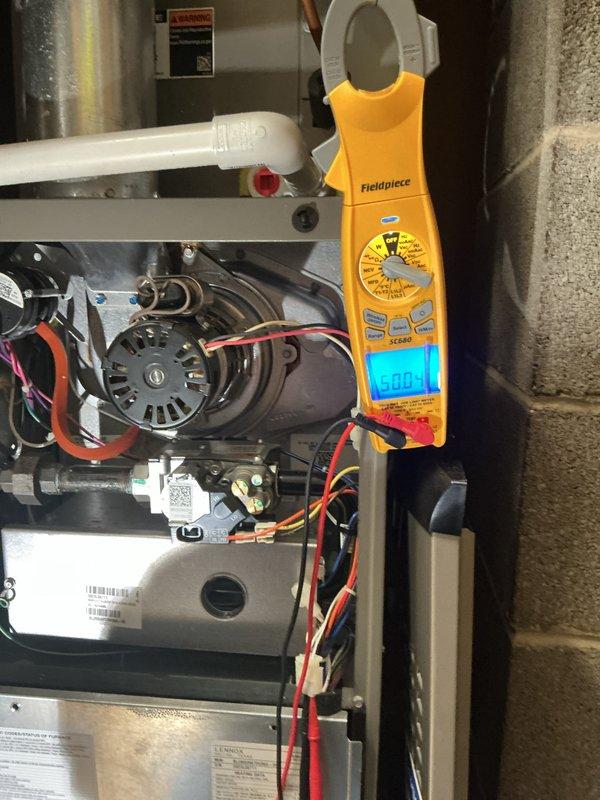 Attempted scheduled MVP heating maintenance visit but unable to gain access as customer did not answer door or phone. Performed exterior system diagnostics and documentation using manometer to verify static pressure readings of 0.23 inches water column and clamp meter to check electrical parameters, with amp draw reading 0.00 indicating system was not in operation at time of visit. Follow-up contact needed to reschedule complete heating system maintenance and inspection.