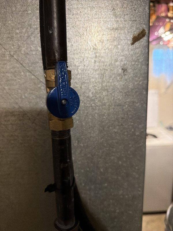 Completed first-stage installation of 80% AFUE furnace system, including gas line connection with new blue-handled ball valve and black iron piping with brass fittings integrated into existing HVAC ductwork. Installed carbon monoxide detector in living area per safety code requirements to monitor combustion appliance operation.