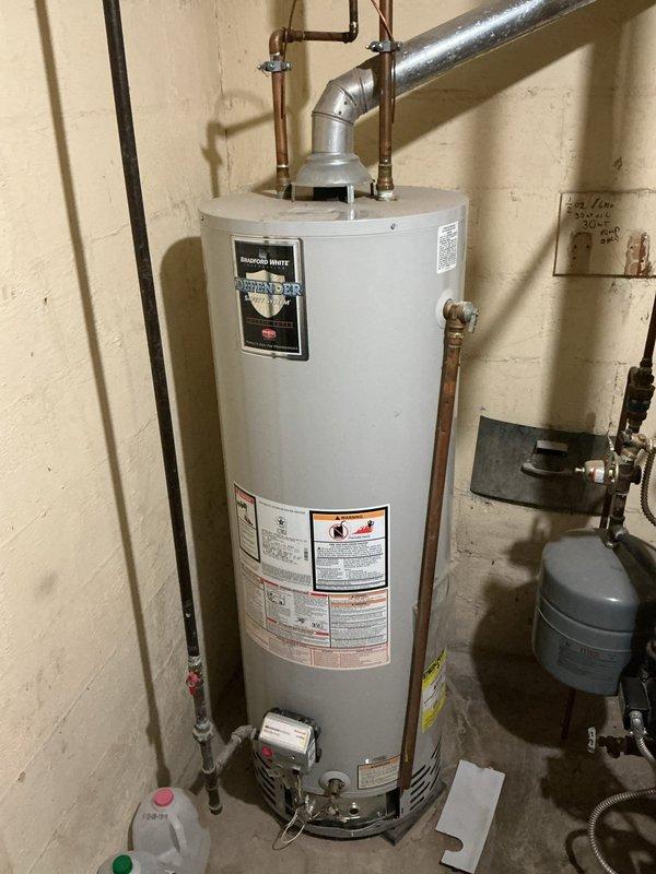 Responded to no-ignition complaint on 15-year-old Bradford White gas water heater. Upon arrival, performed diagnostic evaluation of the unit's ignition system and gas control valve assembly. Inspected the FGCV (Flammable Vapor Ignition Resistant) control system, including the electronic ignition module, thermocouple/flame sensor, and gas valve operation. Reviewed diagnostic LED codes on the control panel to identify fault conditions. Tested gas supply pressure and verified proper venting configuration with metal flue pipe. Examined all safety interlocks and thermal limit switches. Assessed the condition of the burner assembly, pilot orifice, and main burner for debris or corrosion that could prevent ignition. Verified electrical connections to the control module were secure and properly grounded. Provided customer with diagnostic findings and repair recommendations for restoring hot water service to the residence.