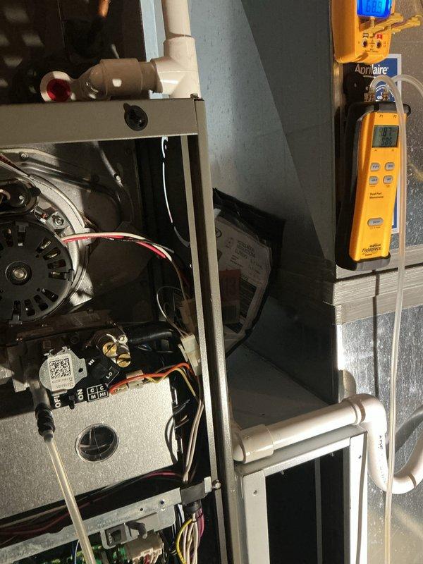 Completed MVP heating maintenance visit on residential HVAC system. Performed thorough inspection of furnace control board, blower motor assembly, and electrical connections. Documented system operation using diagnostic equipment to verify proper voltage and amperage readings. All components found operating within manufacturer specifications, wiring connections secure, and control board functioning properly.