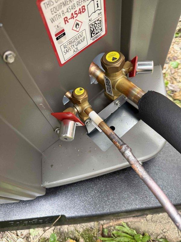 Completed full HVAC system installation featuring a high-efficiency 2-stage furnace with 97% AFUE rating paired with a 16 SEER air conditioning unit. Installed new outdoor condensing unit with R-454B refrigerant, dual contactors, capacitors, and brass service valves with proper copper line connections and insulation. All electrical connections secured, refrigerant lines properly installed and insulated, and system mounted on concrete pad with complete startup and testing performed to verify proper operation.