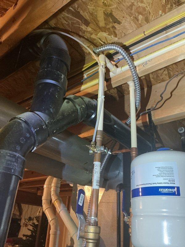 Responded to service call for damaged refrigerator water line with active leak. Upon arrival, located the compromised water supply line in the basement area near the water filtration system and main plumbing infrastructure. Shut off water supply at the isolation valve, removed the damaged refrigerator supply line, and installed a new braided stainless steel water line with proper compression fittings. Verified all connections were secure, restored water supply, and tested the new installation for leaks. System operating properly with no leaks detected at time of departure.
