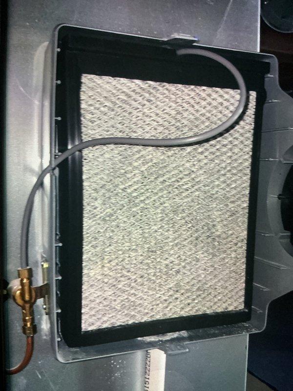 Completed MVP furnace maintenance service including full system inspection and air filter replacement. Removed heavily soiled pleated air filter showing significant dust and particle accumulation, installed new filter with proper seating in mounting frame, and verified all refrigerant lines and connections were secure with no visible leaks or damage.
