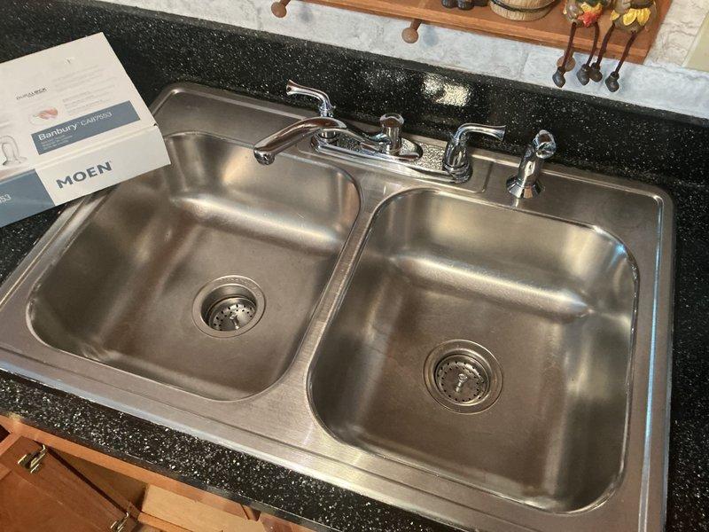Responded to service call for kitchen drain inspection and disconnection of dishwasher and garbage disposal. Upon arrival, assessed double-basin stainless steel sink installation with existing plumbing configuration. Successfully disconnected garbage disposal unit from sink drain assembly and electrical supply. Disconnected dishwasher drain line from disposal unit and water supply connections. Removed disposal mounting hardware from sink flange. Capped drain lines as necessary to prevent leaks. Verified all shut-off valves were properly closed and inspected P-trap assembly for proper drainage. Left under-sink cabinet area clean and organized with all disconnected components accessible for customer. Kitchen sink remains functional for standard drainage use.