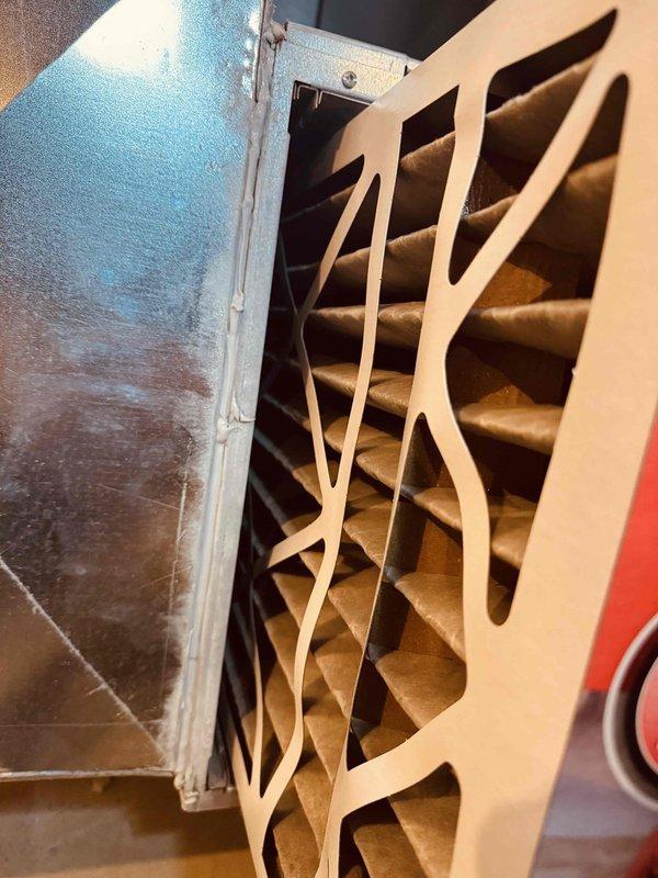 Completed MVP heating maintenance inspection on residential HVAC system. Inspected blower motor assembly, electrical connections, and wiring harnesses within the air handler unit, confirming all components were properly secured and operational. Examined and documented the air filtration system, noting the pleated filter media installed in the ductwork with proper fitment in the metal housing.