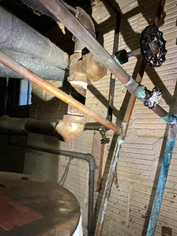 Responded to no hot water complaint at residential property. Upon inspection, found existing tanked water heater had failed and required complete replacement. Assessed existing plumbing infrastructure including aged copper supply lines, shutoff valves, and connections showing significant corrosion and deterioration. Removed old water heater unit and installed new tanked water heater with proper venting and code-compliant connections. Tested all hot water fixtures to confirm proper operation and adequate water temperature throughout the home.