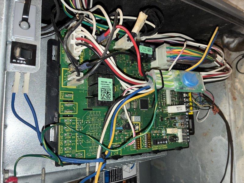 Completed comprehensive maintenance inspection on gas-fired furnace system, including detailed examination of the integrated control board assembly and electronic components. Accessed and photographed the dual-board control system with interconnected wiring harnesses, verifying proper connections across all color-coded wire terminals and ensuring secure seating of all connectors. All electronic components, including integrated circuits, capacitors, and resistors, were inspected for signs of wear or damage, with no issues identified during the maintenance visit.