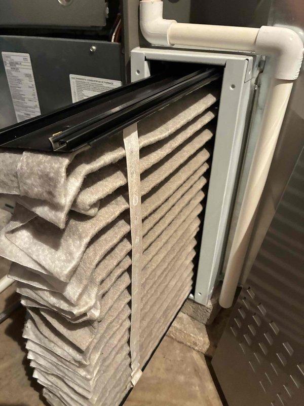 Performed seasonal tune-up on a 2-year-old gas furnace, including inspection of the cabinet and venting. Removed the heavily soiled pleated media filter and replaced it per customer request to restore proper airflow. Inspected and cleaned the flame sensor to remove oxidation buildup and ensure reliable flame proving and ignition.