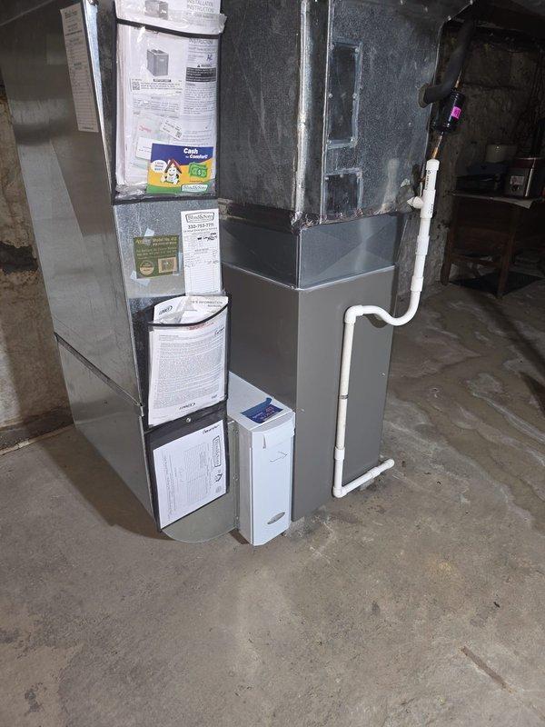 Performed MVP furnace maintenance on an upright gas furnace with attached evaporator cabinet, including inspection of the Lennox integrated control board, wiring harnesses, and connections for signs of burning, corrosion, or damage. Verified condensate drain and PVC venting and ductwork were intact and free of leaks, frost, or rust, and confirmed the filter and system documentation were in place. Unit was left in good working condition with no deficiencies noted.
