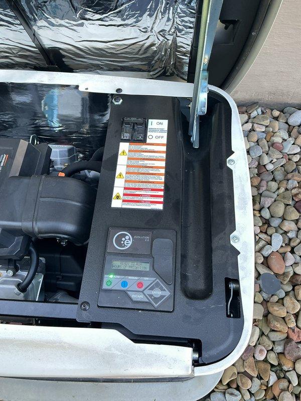 Performed scheduled maintenance on a 2-year-old Generac Guardian 18kW standby generator, including inspection of the enclosure, control panel, and engine compartment. The Evolution 2.0 controller was operational with the main breaker and indicator light normal, and the unit was found clean and in good condition with no rust, cracks, or damage, and was left ready for standby operation.