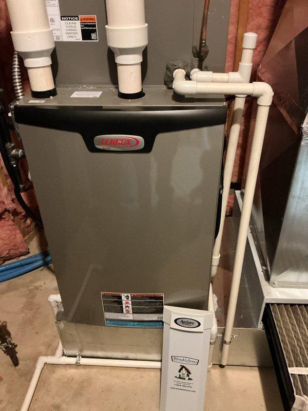 Performed seasonal cooling maintenance on the Lennox high-efficiency furnace and air handler system, inspecting the control board, wiring harness, and electrical connections for signs of damage, burning, or loose terminals, with all components found secure and in good condition. Verified the PVC condensate drain line and vent piping were intact and free of cracks, leaks, or obstructions, and confirmed no frost, rust, or visible damage on the unit or surrounding ductwork and return plenum.