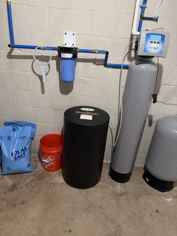 Delivered and placed two bags of solar salt for the water softener brine tank during a scheduled maintenance visit, and supplied a replacement pleated sediment filter cartridge for the whole-house filtration system. System inspection found the softener, control valve, and PEX supply lines in good condition, with no leaks, rust, or corrosion observed.