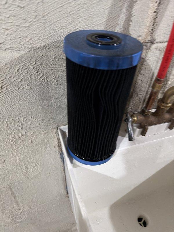 Delivered and placed two bags of solar salt for the water softener brine tank during a scheduled maintenance visit, and supplied a replacement pleated sediment filter cartridge for the whole-house filtration system. System inspection found the softener, control valve, and PEX supply lines in good condition, with no leaks, rust, or corrosion observed.