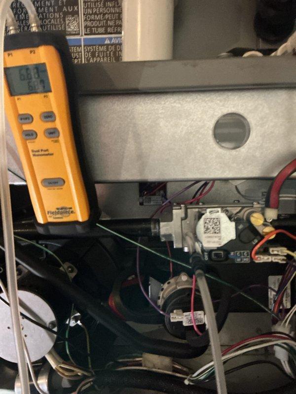 Performed scheduled heating maintenance on the gas furnace, including inspection of the gas valve assembly, pressure switch, wiring connections, and condensate/venting components. Verified gas pressure and system pressure readings using a digital dual-port manometer, with all components found in good working condition and no visible corrosion, damage, or abnormalities noted.