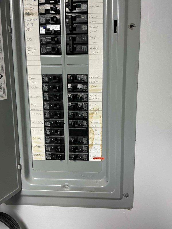 Performed an on-site evaluation for a standby generator replacement, as the existing Generac unit is aged and not operating properly. Inspected the main electrical service panel, including the breaker layout, circuit directory labeling, available breaker spaces, and panel condition, and documented water staining on the directory strip along with an AFCI-protected circuit. Gathered the information needed to size and quote a new generator installation with transfer switch connection.