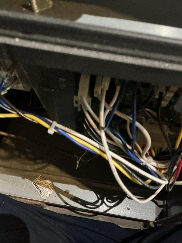 Performed annual furnace maintenance on a 1-year-old gas furnace, including inspection of the control compartment, wiring harness, circuit board connections, gas valve, and gas piping. Removed and inspected the flame sensor, and cleaned light dust and debris from the cabinet interior. Noted unterminated wire ends in the control compartment, and found no signs of rust, frost, or component breakage.