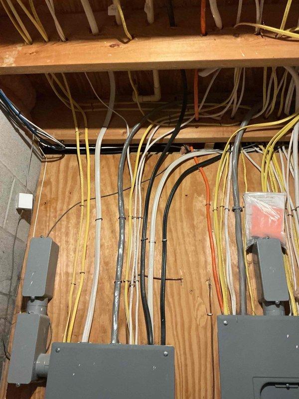 Performed an on-site assessment for a new exterior outlet installation, including inspection of the main breaker panel, existing branch circuit wiring, and available panel capacity. Evaluated cable routing options from the panel and surrounding joist area to the exterior wall location, and noted loose conductors and unsecured wiring near the panel that should be addressed during installation. Provided an estimate for the proposed outlet installation work.