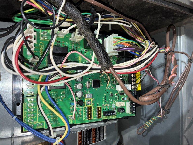 Performed a heating maintenance visit including inspection of the furnace control board and low-voltage wiring, and noted loose, tangled wiring with a frayed braided cable sleeve exposing copper strands that should be secured and repaired to prevent shorting or intermittent faults. Completed combustion analysis on the natural gas appliance, recording O2 at 5.6%, CO at 61 ppm, CO2 at 8.6%, and efficiency at 95.3%. The unit is operating with acceptable combustion efficiency, though CO levels should be monitored at future visits.