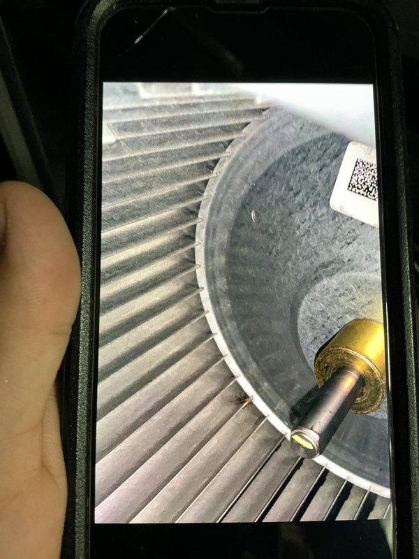 Performed scheduled heating maintenance, inspecting the system's filter media and blower assembly and documenting their condition. Observed dust and lint accumulation on the filter mesh and across the blower wheel blades and housing, which can restrict airflow and reduce heating efficiency. Verified the blower wheel, motor shaft, and hub were intact and in serviceable condition.