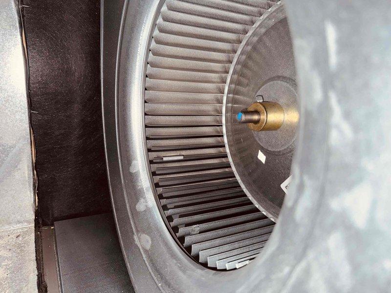 Performed annual tune-up on 4-year-old gas furnace, including combustion analysis with a Bacharach analyzer (O2 9.1%, CO 28 ppm, CO2 6.6%, efficiency 84.8%) to verify safe, proper operation. Inspected the blower assembly and squirrel-cage wheel, finding only light dust on the housing and blade edges with no damage or significant buildup; the system was left operating normally.