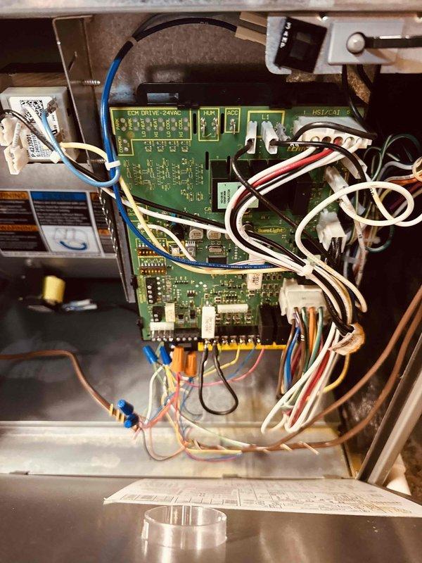 Performed annual maintenance on a 2-year-old gas furnace, including inspection of the integrated control board, wiring harnesses, and connections, with no signs of burning, corrosion, or physical damage observed. Verified heating performance using digital probes, recording a 52.7°F temperature rise across the heat exchanger (128.3°F supply vs. 75.6°F return), confirming the furnace is operating within normal parameters.