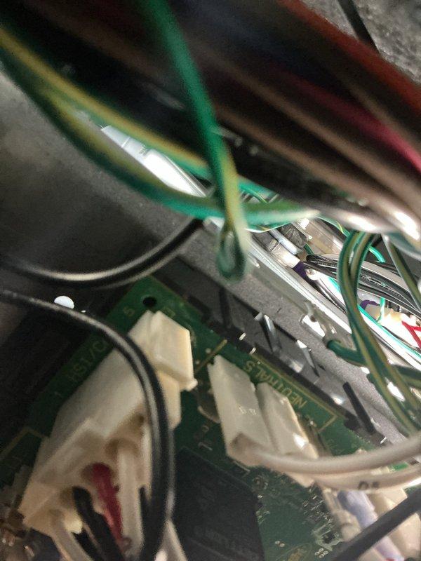Performed a scheduled heating maintenance visit, inspecting the furnace control board wiring and neutral connections and finding no signs of damage, corrosion, or overheating. Used a clamp meter to perform electrical diagnostics at the gas valve and wiring harness area, with no visible deficiencies noted in the cabinet interior.