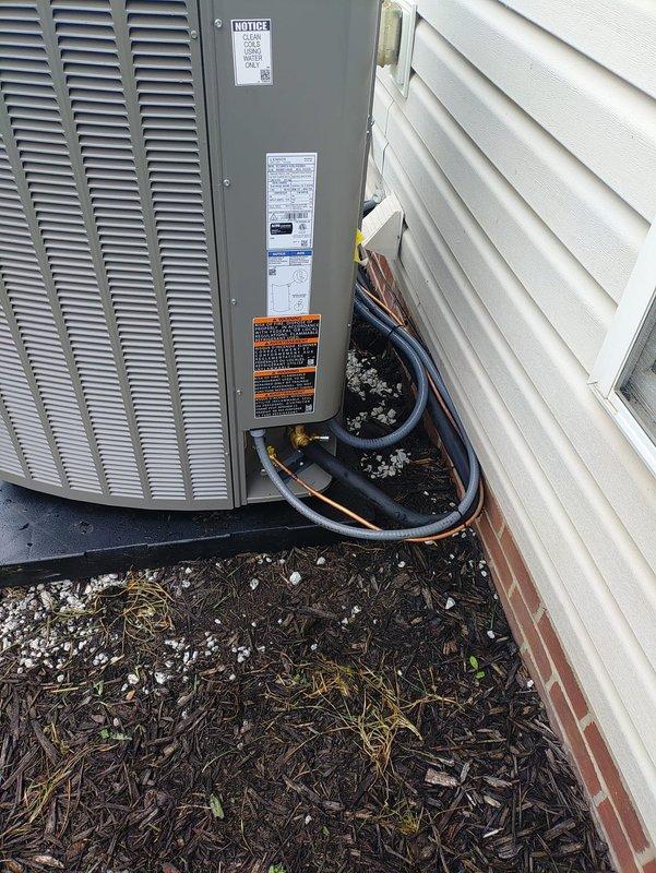 Installed a complete HVAC system consisting of a 90% AFUE high-efficiency gas furnace, a Lennox outdoor air conditioning condenser, a whole-home humidifier, and a programmable thermostat. The condenser was set on a level composite pad with insulated refrigerant lines, a line set connection, a disconnect, and flexible conduit properly routed along the exterior wall. The system was started and verified for proper operation, with all components functioning as intended.