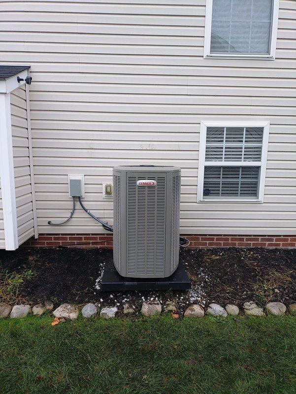 Installed a complete HVAC system consisting of a 90% AFUE high-efficiency gas furnace, a Lennox outdoor air conditioning condenser, a whole-home humidifier, and a programmable thermostat. The condenser was set on a level composite pad with insulated refrigerant lines, a line set connection, a disconnect, and flexible conduit properly routed along the exterior wall. The system was started and verified for proper operation, with all components functioning as intended.