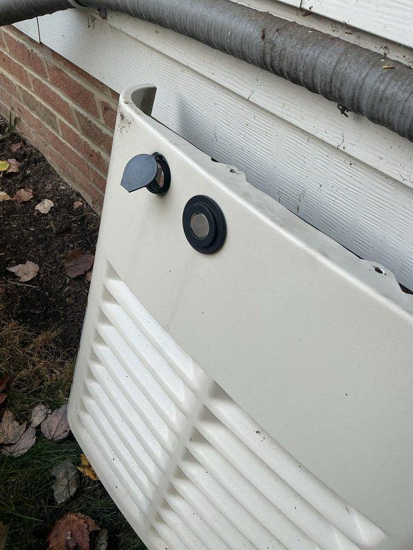 Performed scheduled maintenance on a 3-year-old Generac 14kW standby generator, including removal of the enclosure cover to inspect and service the unit's interior components. Cleared accumulated leaves and debris from the louvered intake vent and wire mesh screen to ensure proper airflow and cooling, then reinstalled the cover panel.