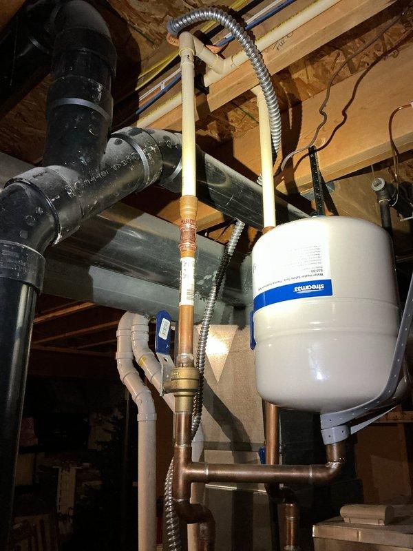 Installed a new code-approved shut-off valve on the cold water supply line nearest the refrigerator and ran a stainless steel braided supply line to the appliance, replacing the existing saddle valve. Capped off the obsolete saddle valve connection, then pressurized the line and inspected all connections, confirming no leaks.