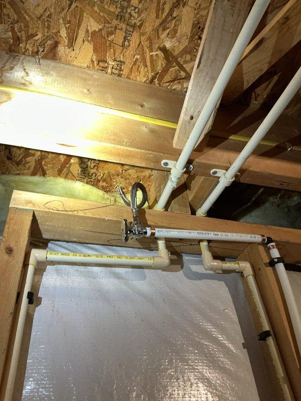 Installed a new code-approved shut-off valve on the cold water supply line nearest the refrigerator and ran a stainless steel braided supply line to the appliance, replacing the existing saddle valve. Capped off the obsolete saddle valve connection, then pressurized the line and inspected all connections, confirming no leaks.
