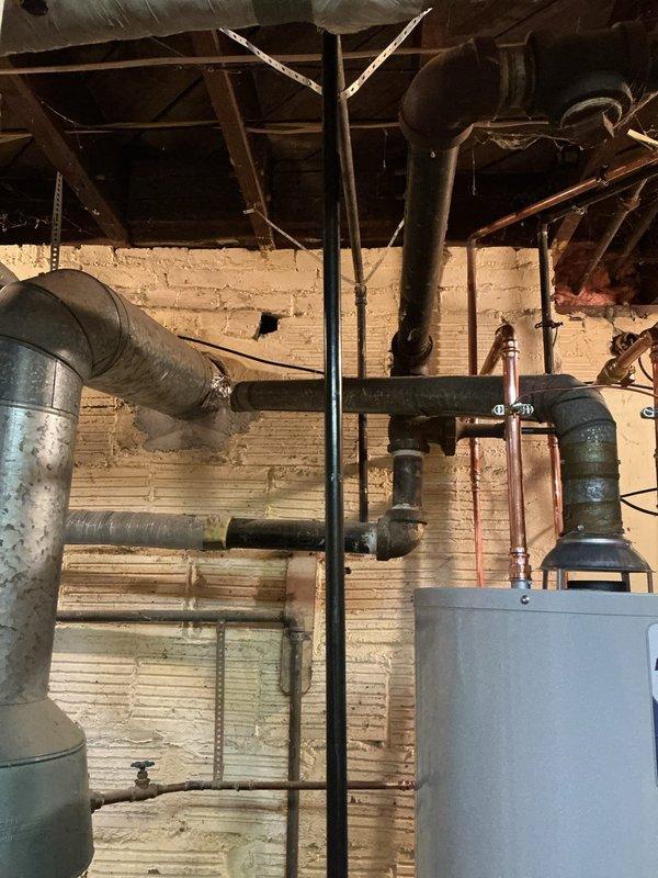 Removed and replaced the existing water heater with a new 40-gallon tall Bradford White unit, installing new water and gas shut-off valves and reconnecting the vent connector. Added strapping to properly support the gas and water supply lines, and installed a thermal expansion tank on the cold water line to protect against pressure buildup. The system was verified free of leaks, and the new tank carries a 6-year warranty.