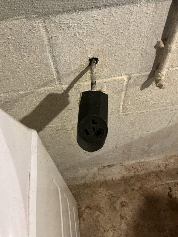 Replaced the heat-damaged pigtail on the dryer receptacle, which showed charring and corrosion on the prongs from a loose, overheated connection. Installed a new 30-amp, 3-prong dryer cord and terminated it securely to the receptacle to restore safe, reliable power to the dryer circuit.