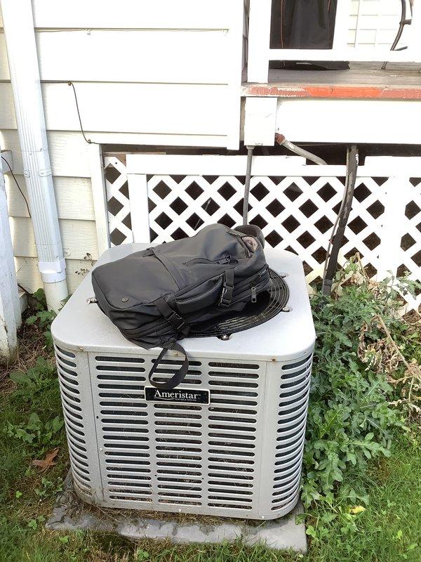 Performed an on-site evaluation of the existing Ameristar outdoor air conditioning condenser and American Standard gas furnace to assess system condition and scope a full split-system replacement. Inspected the condenser pad, surrounding clearances, and furnace, flue, and plenum configuration, and documented the equipment with photos for replacement estimating. Noted overgrown vegetation around the condenser and no obvious rust or physical damage at the furnace.