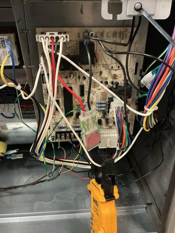 Performed scheduled heating maintenance on a Lennox gas furnace, inspecting the control board, wiring harnesses, and connectors and verifying electrical operation with a clamp meter. Checked the intake/exhaust PVC venting and condensate neutralizer drain assembly, finding no signs of burning, corrosion, or frost. System components were found in serviceable condition and operating normally.