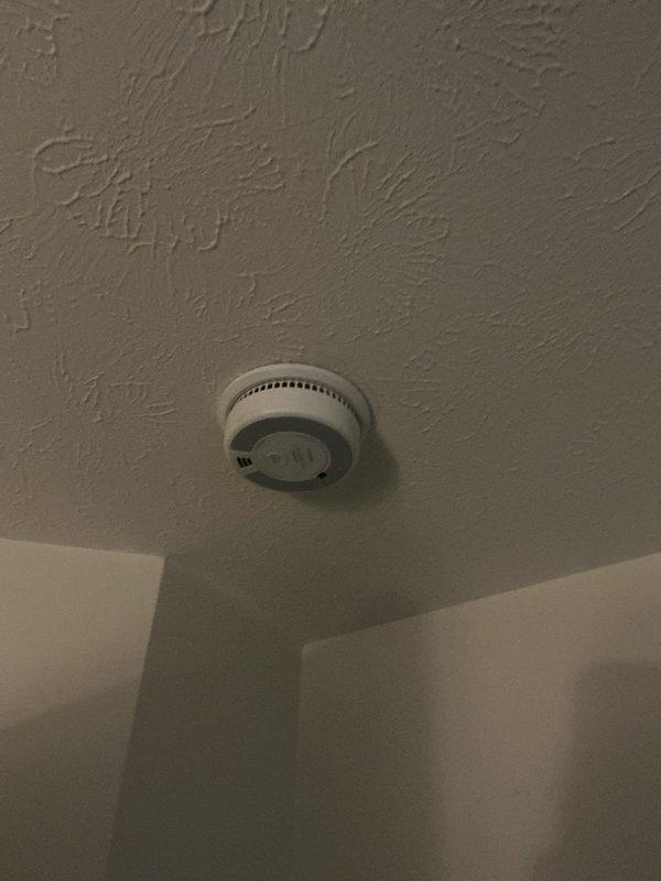 Installed nine Xsense wireless interconnected smoke detectors throughout the residence, covering the second-floor bedrooms and hallway, the first floor near the basement stairs, and the basement bedroom, hallway, and playroom. Also installed a carbon monoxide detector adjacent to the furnace, providing interconnected life-safety coverage on all levels.