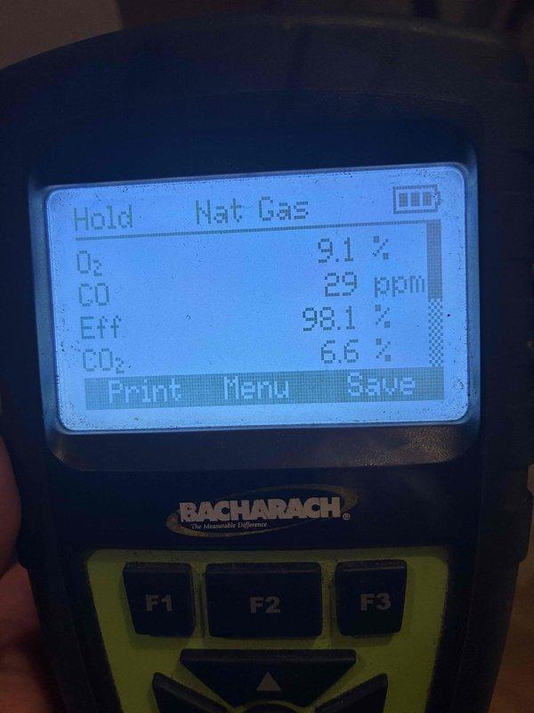 Performed a scheduled heating maintenance visit on a natural gas furnace, including a combustion analysis with a Bacharach analyzer that recorded O2 at 9.1%, CO at 29 ppm, CO2 at 6.6%, and 98.1% efficiency. Inspected the control board, wiring harness, blower housing, pressure switch, and PVC vent/intake piping and found all components intact with no visible damage, corrosion, or wiring concerns. The unit was left in good operating condition.