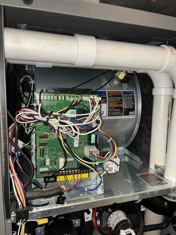 Performed a scheduled heating maintenance visit on a natural gas furnace, including a combustion analysis with a Bacharach analyzer that recorded O2 at 9.1%, CO at 29 ppm, CO2 at 6.6%, and 98.1% efficiency. Inspected the control board, wiring harness, blower housing, pressure switch, and PVC vent/intake piping and found all components intact with no visible damage, corrosion, or wiring concerns. The unit was left in good operating condition.