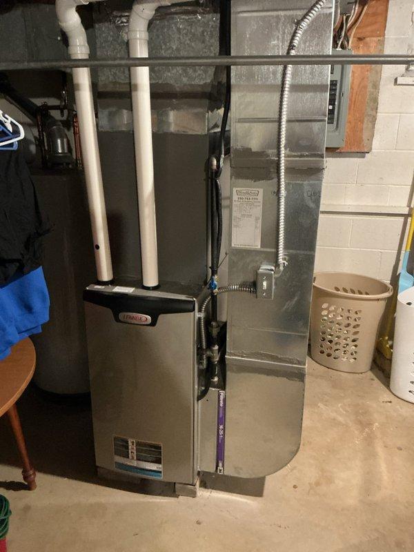 Performed scheduled heating maintenance on a Lennox upright gas furnace, including inspection of the blower assembly, where a light accumulation of dust was observed on the squirrel-cage wheel fins with no signs of rust, breakage, or frost. Verified the condition of the furnace cabinet, PVC venting, ductwork, filter housing, and electrical connections, with no visible damage or deficiencies noted, and the system is operating normally.