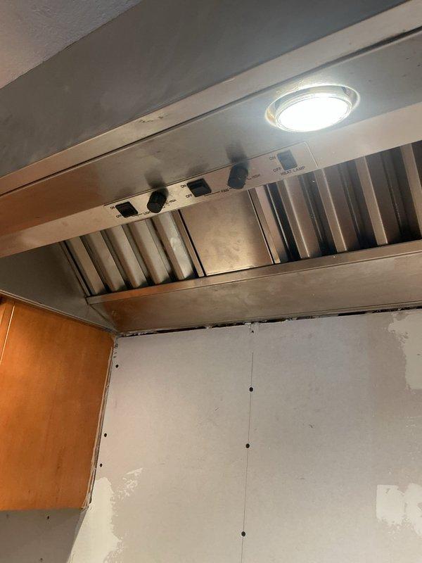 Re-fed the kitchen range hood circuit, removing the outlet above the stove and rerouting the hood vent supply down to the stove receptacle location behind the range to clear the wall for renovation. Replaced the foyer chandelier and installed a customer-provided under-cabinet light fixture, with all devices tested for proper operation.