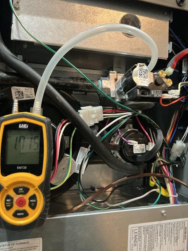 Performed MVP heating maintenance on a Lennox gas furnace, including inspection of the inducer motor, gas valve, wiring harness, and venting components. Verified gas valve manifold pressure and pressure readings using a digital manometer, and confirmed the unit was free of visible damage, rust, or frost, with all connections secure and the furnace operating within normal parameters.