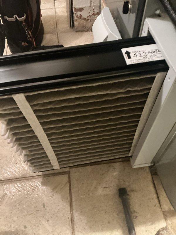 Performed seasonal cooling maintenance on the HVAC system, including a borescope inspection of the ductwork interior that revealed crumpled foil-faced insulation and debris within the cavity. Inspected the return air filter and found the pleated media heavily loaded with dust and debris, indicating restricted airflow and the need for replacement. System components were evaluated to confirm proper operation and efficiency.
